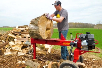 Using a log splitter rental to split a large log